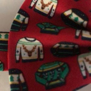 Bow tie with colorful sweater, red background